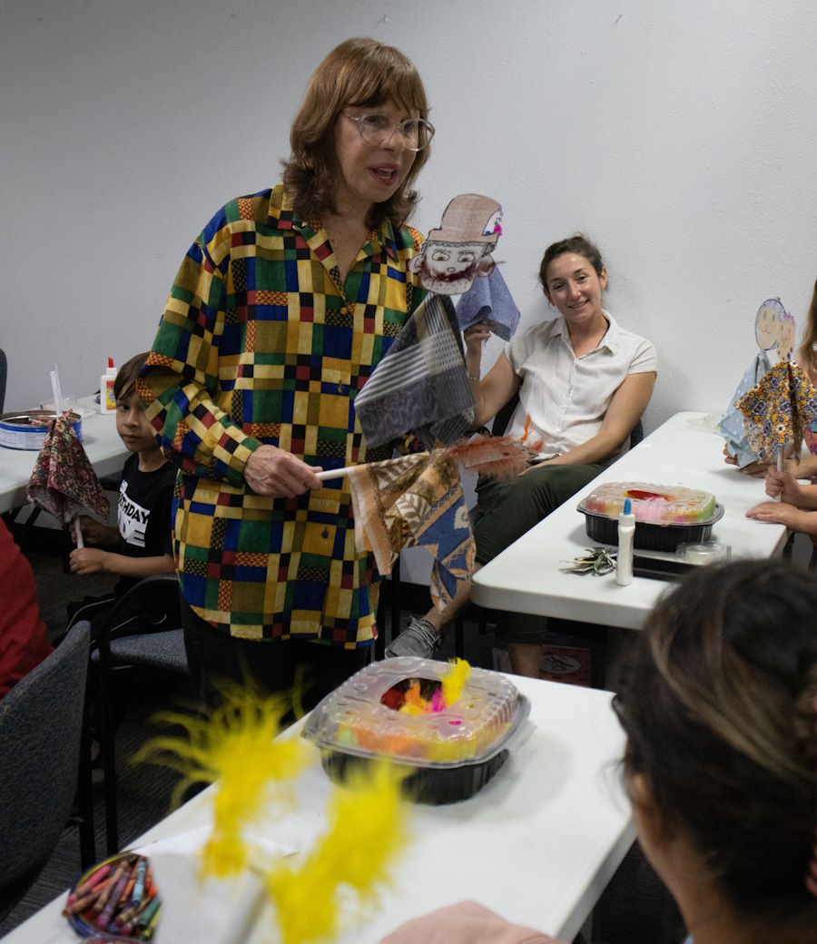 An instructor holding a puppet