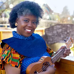 A woman smiling into the camera